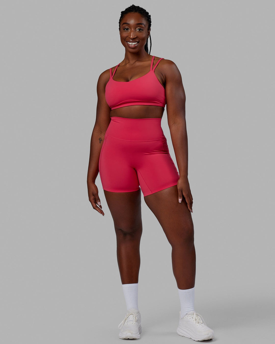 Woman wearing Elixir Mid Short Tights with Pockets - Raspberry