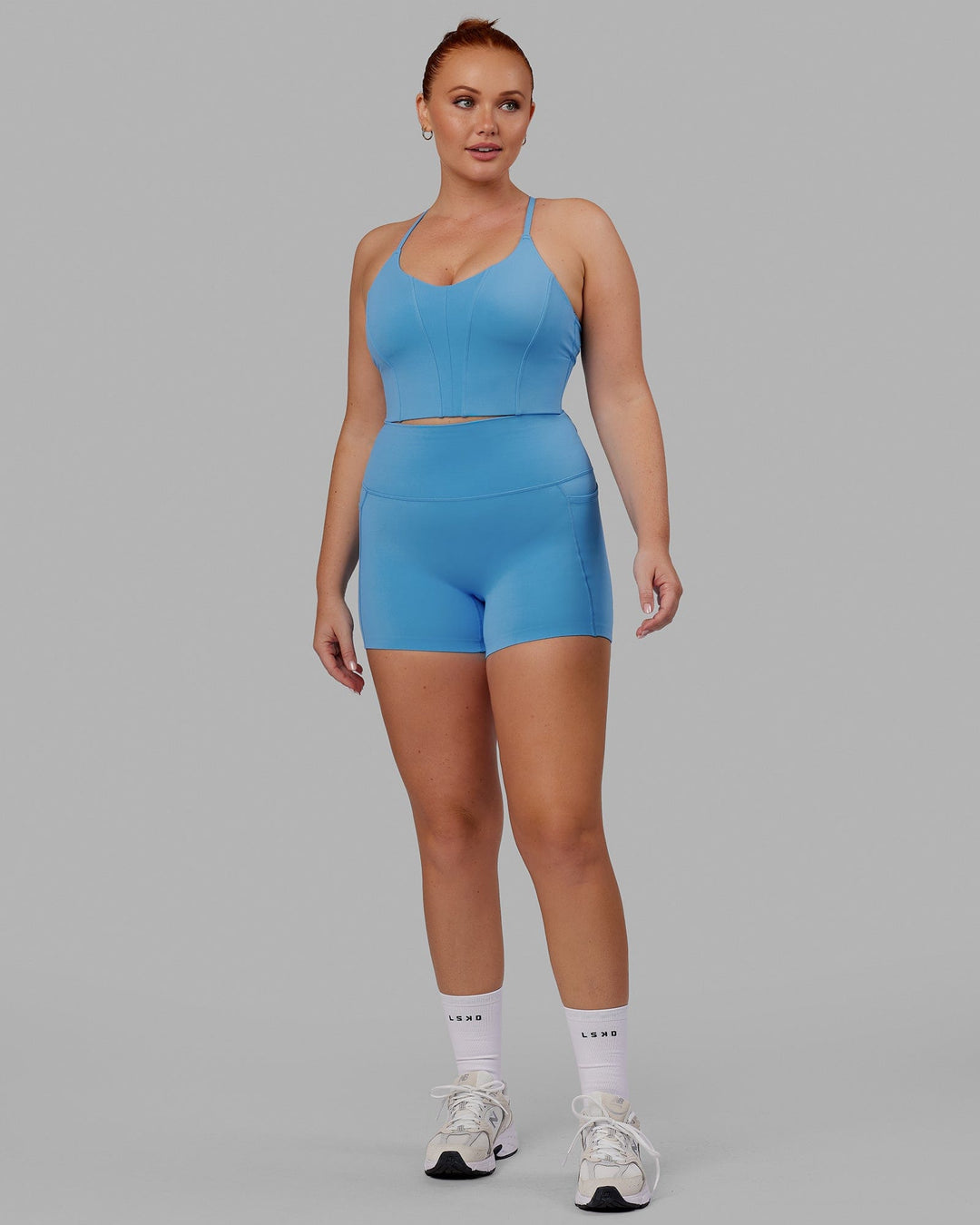 Woman wearing Elixir X-Short Tight With Pockets - Azure Blue