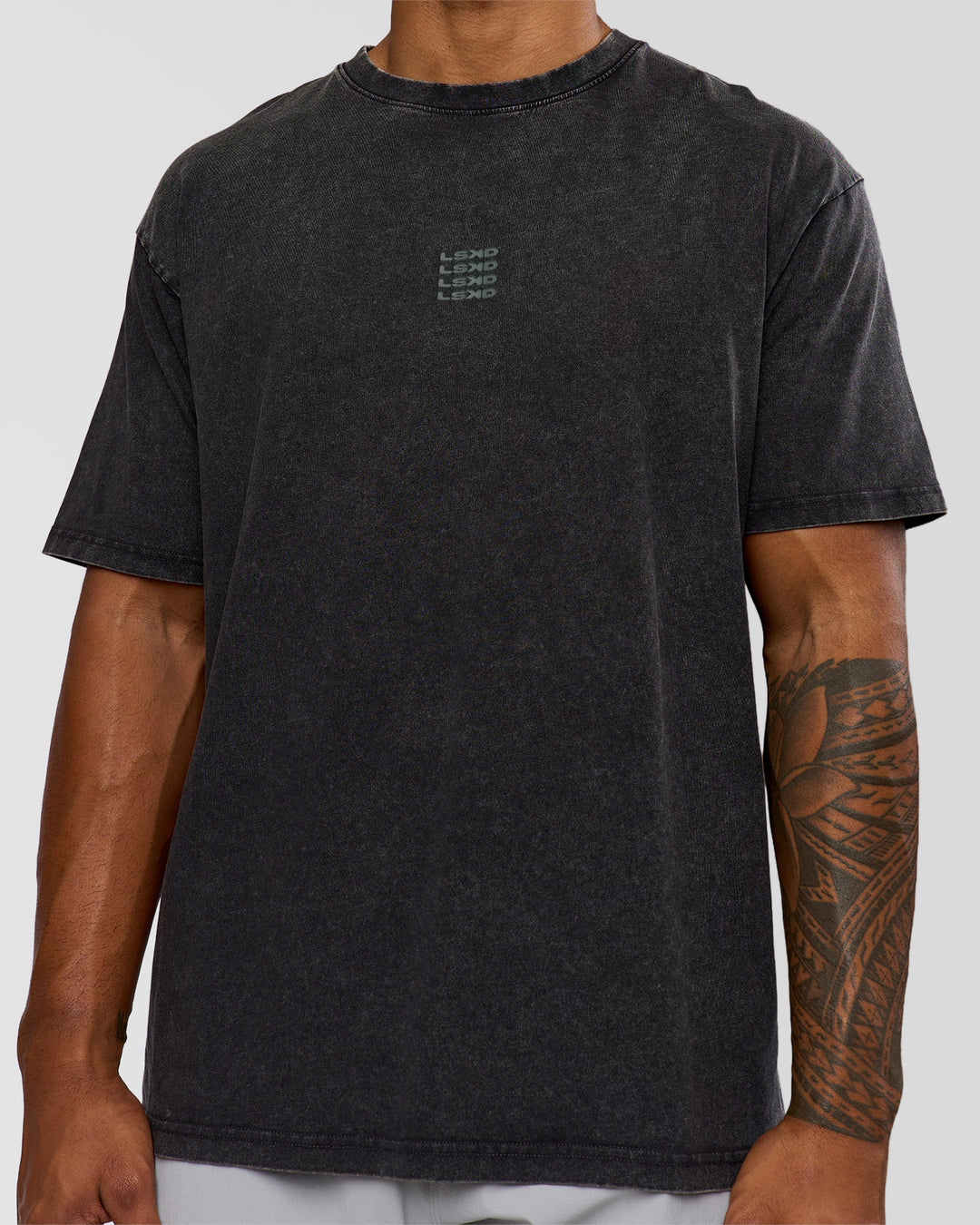 Man wearing Everyday Elevation FLXCotton Oversized Tee - Black Washed-Carbon Green | Model:Xav | Size:L
