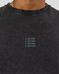 Man wearing Everyday Elevation FLXCotton Oversized Tee - Black Washed-Carbon Green | Model:Xav | Size:L
