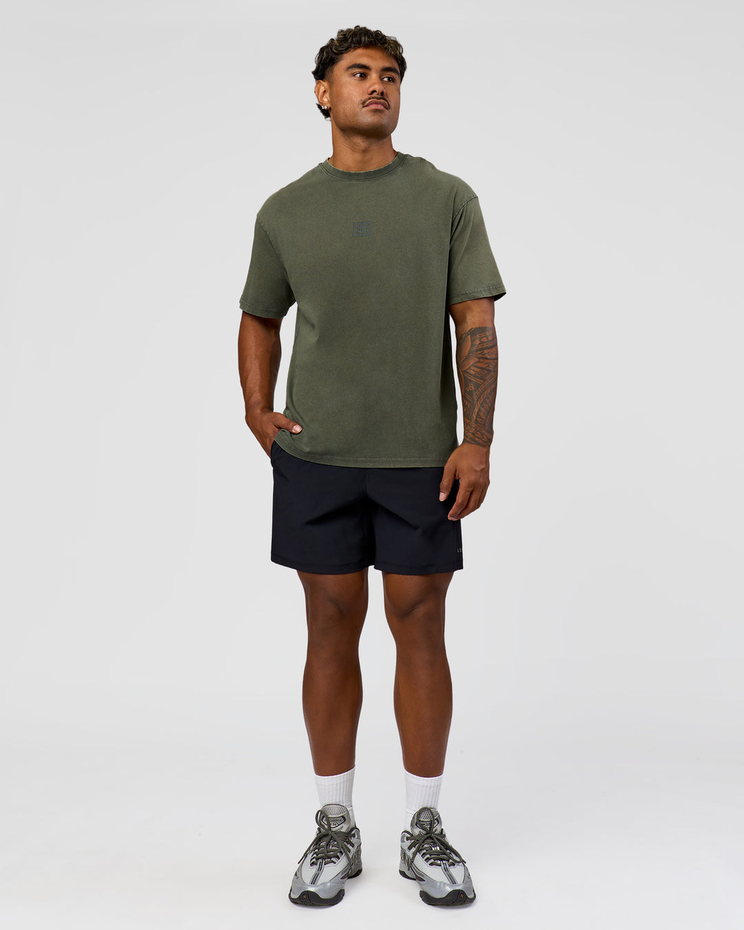 Man wearing Everyday Elevation FLXCotton Oversized Tee - Carbon Green Washed -White | Model:Xav | Size:L