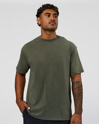 Man wearing Everyday Elevation FLXCotton Oversized Tee - Carbon Green Washed -White | Model:Xav | Size:L