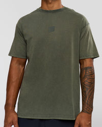 Man wearing Everyday Elevation FLXCotton Oversized Tee - Carbon Green Washed -White | Model:Xav | Size:L