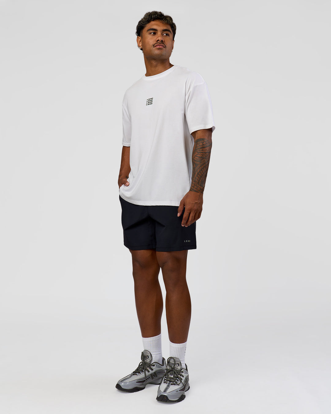 Man wearing Everyday Elevation FLXCotton Oversized Tee - White-Carbon Green | Model:Xav | Size:L