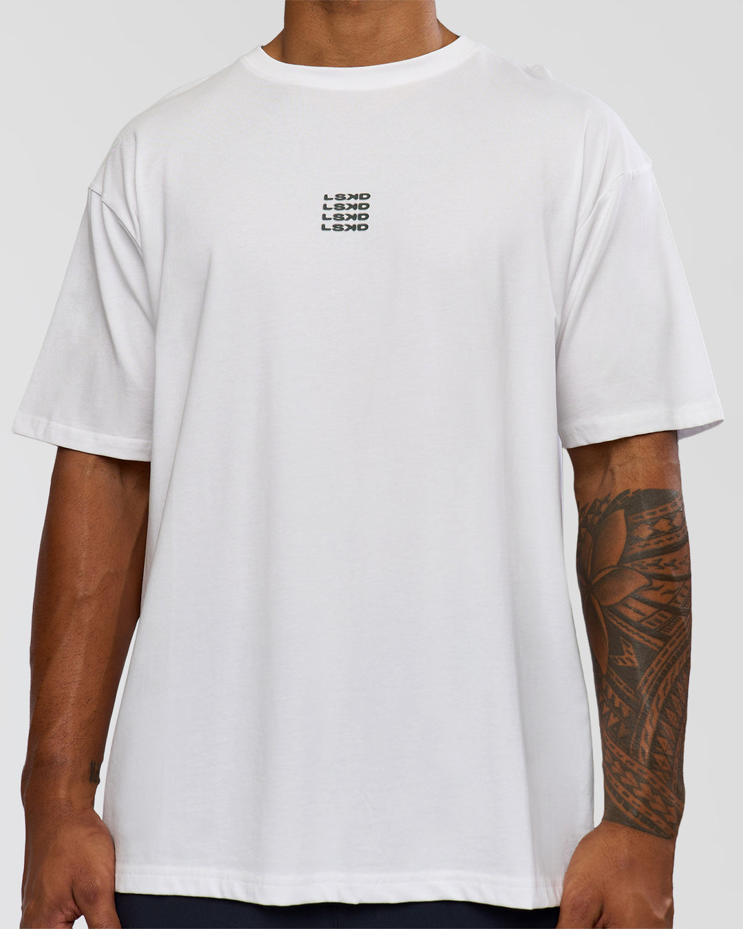 Man wearing Everyday Elevation FLXCotton Oversized Tee - White-Carbon Green | Model:Xav | Size:L