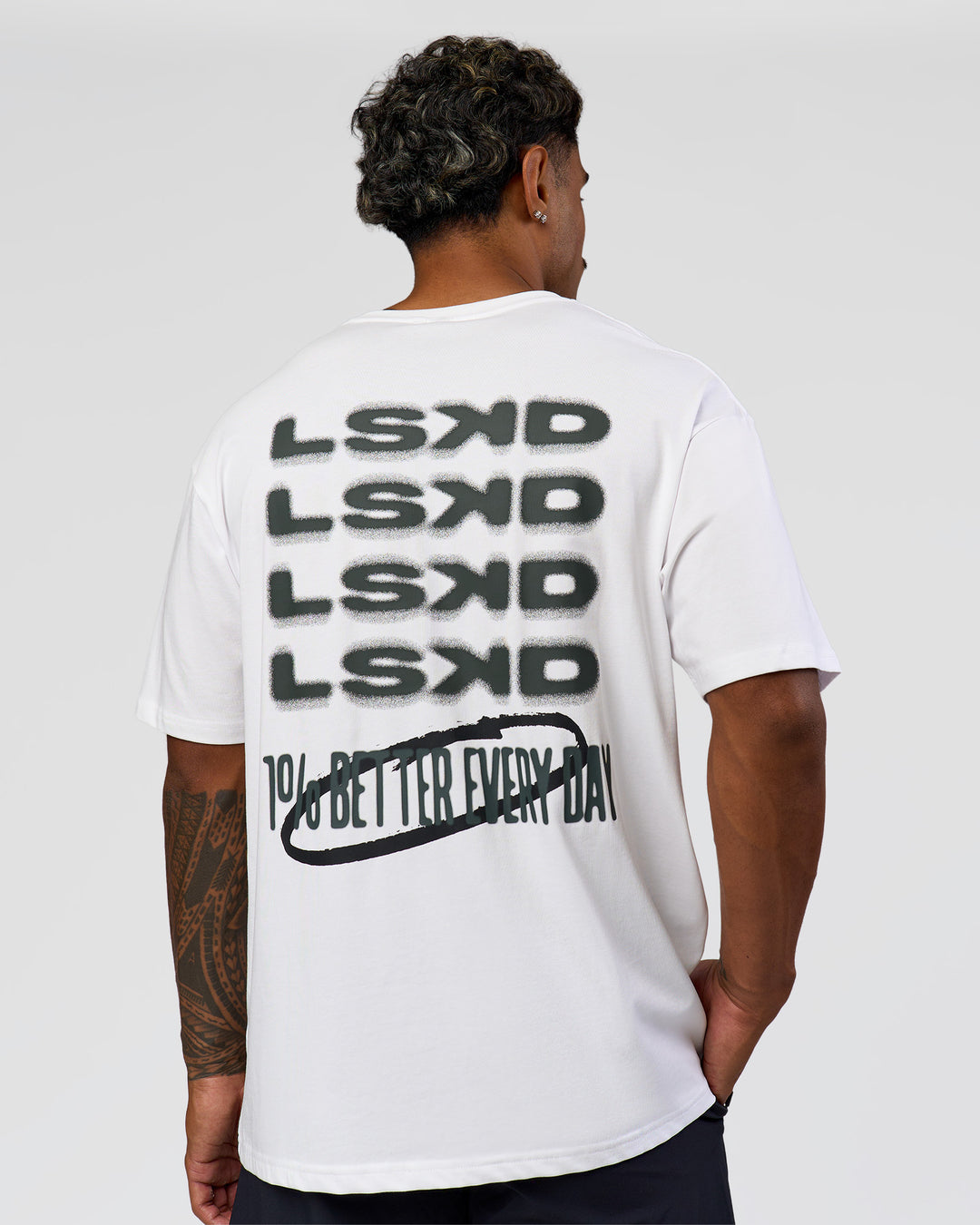 Man wearing Everyday Elevation FLXCotton Oversized Tee - White-Carbon Green | Model:Xav | Size:L