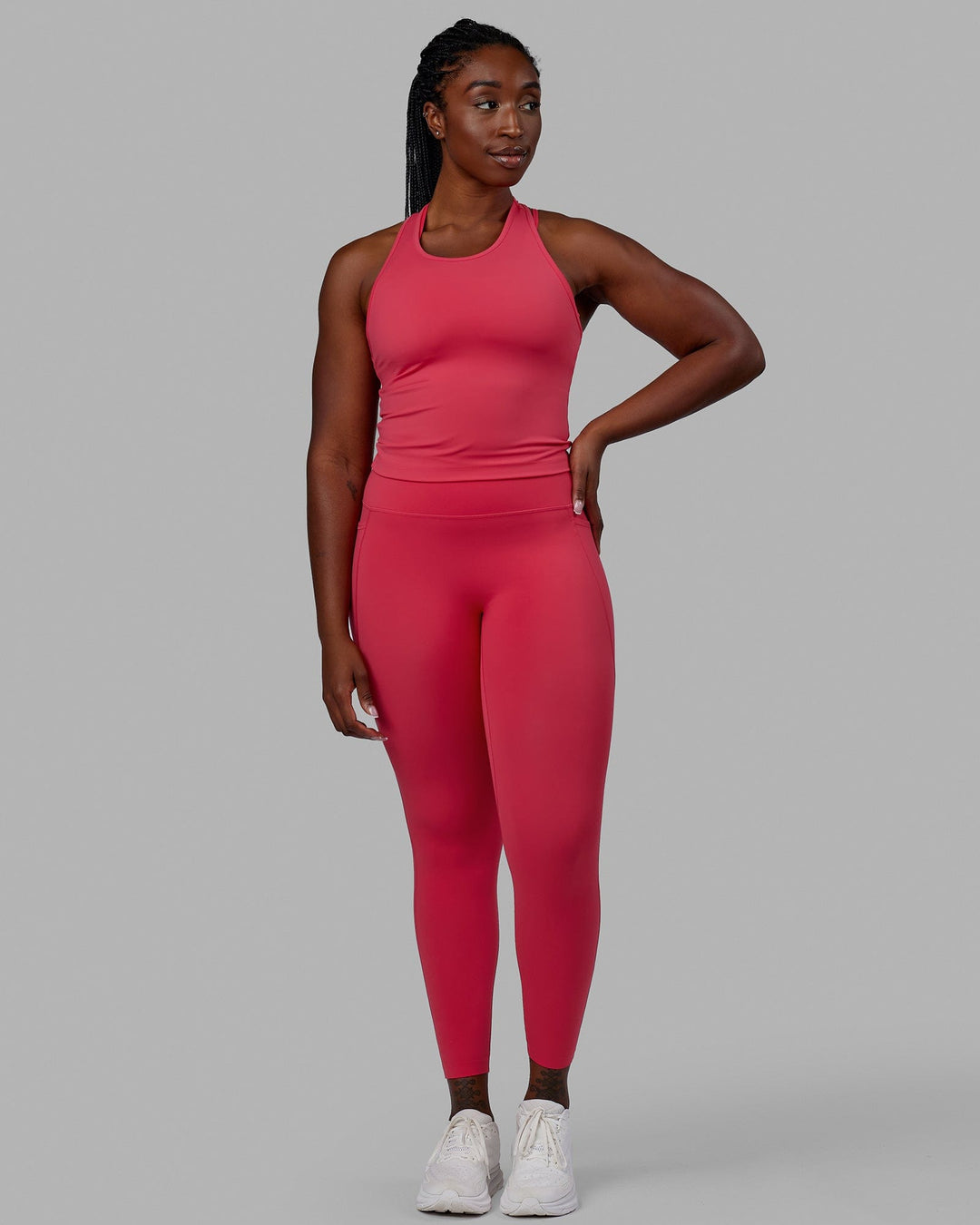 Woman wearing Flow Performance Tank - Raspberry