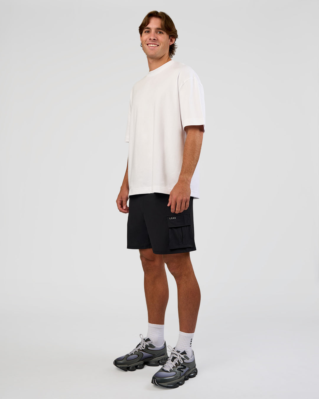 Man wearing Functional Cargo 6" Short - Black | Model:Marcus | Size:L
