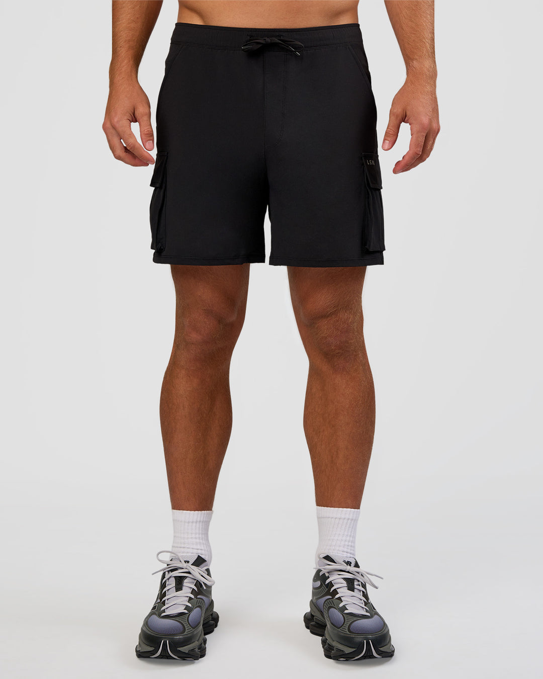 Man wearing Functional Cargo 6" Short - Black | Model:Marcus | Size:L