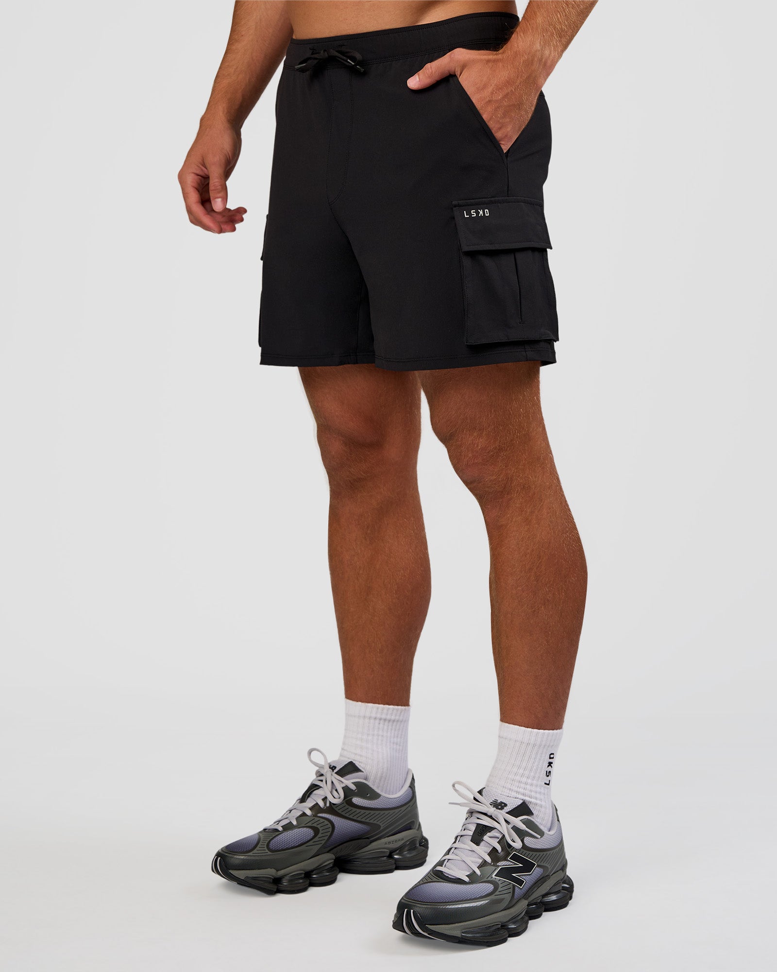 Man wearing Functional Cargo 6" Short - Black | Model:Marcus | Size:L