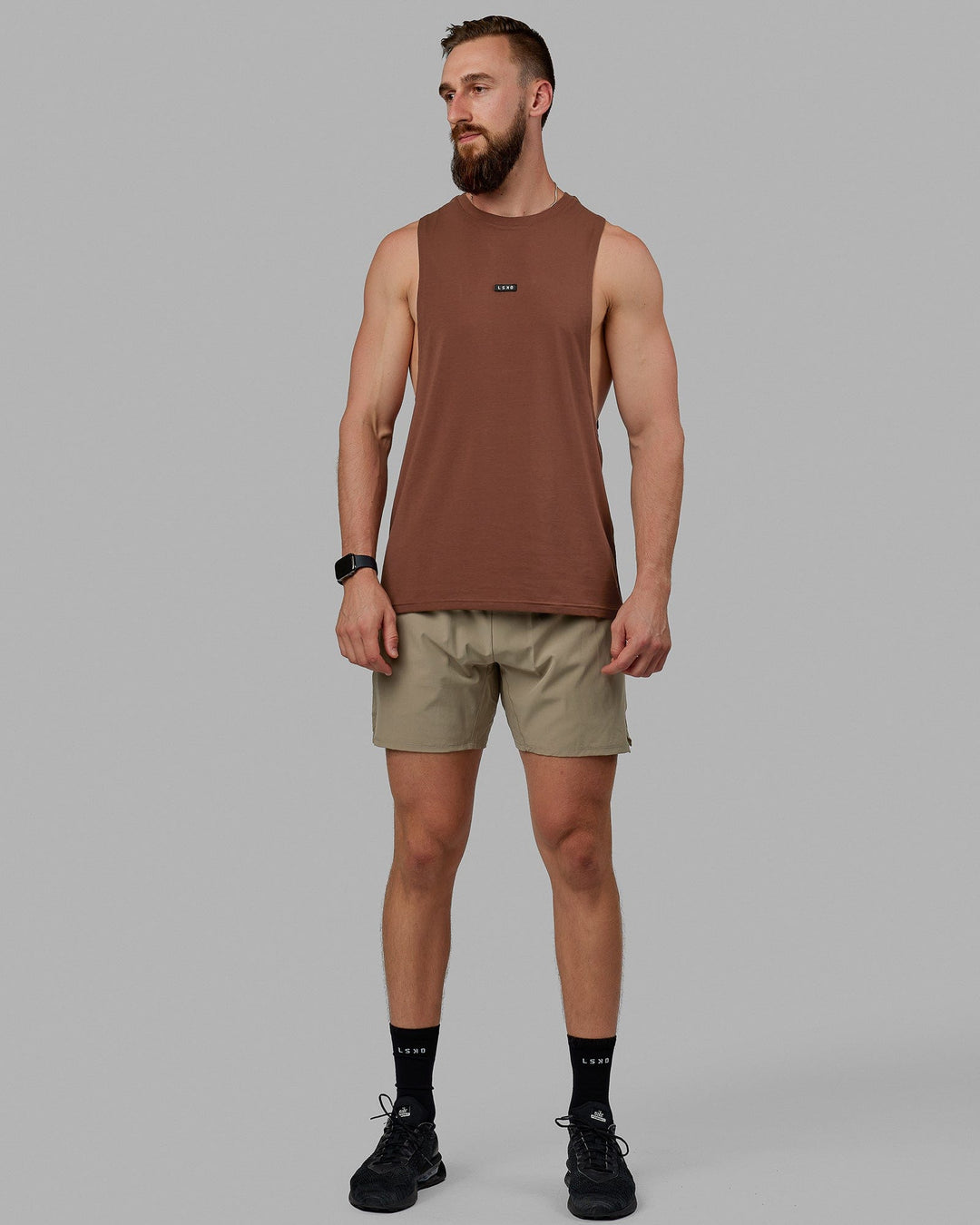 Man wearing Fundamental FLXCotton Drop Arm Tank - Cappuccino