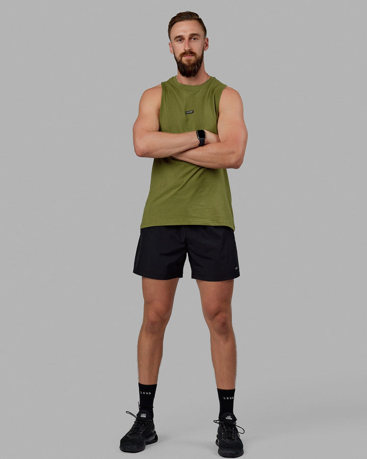 Man wearing Fundamental FLXCotton Drop Arm Tank - Moss