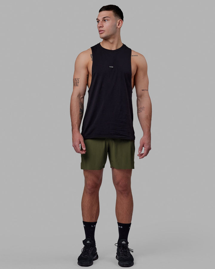 Man wearing Fundamental FLXCotton Drop Arm Tank - Black