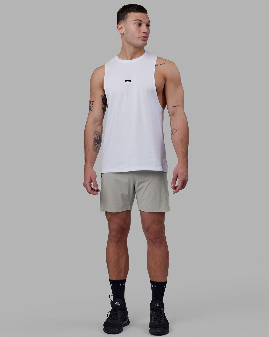 Man wearing Fundamental FLXCotton Drop Arm Tank - White