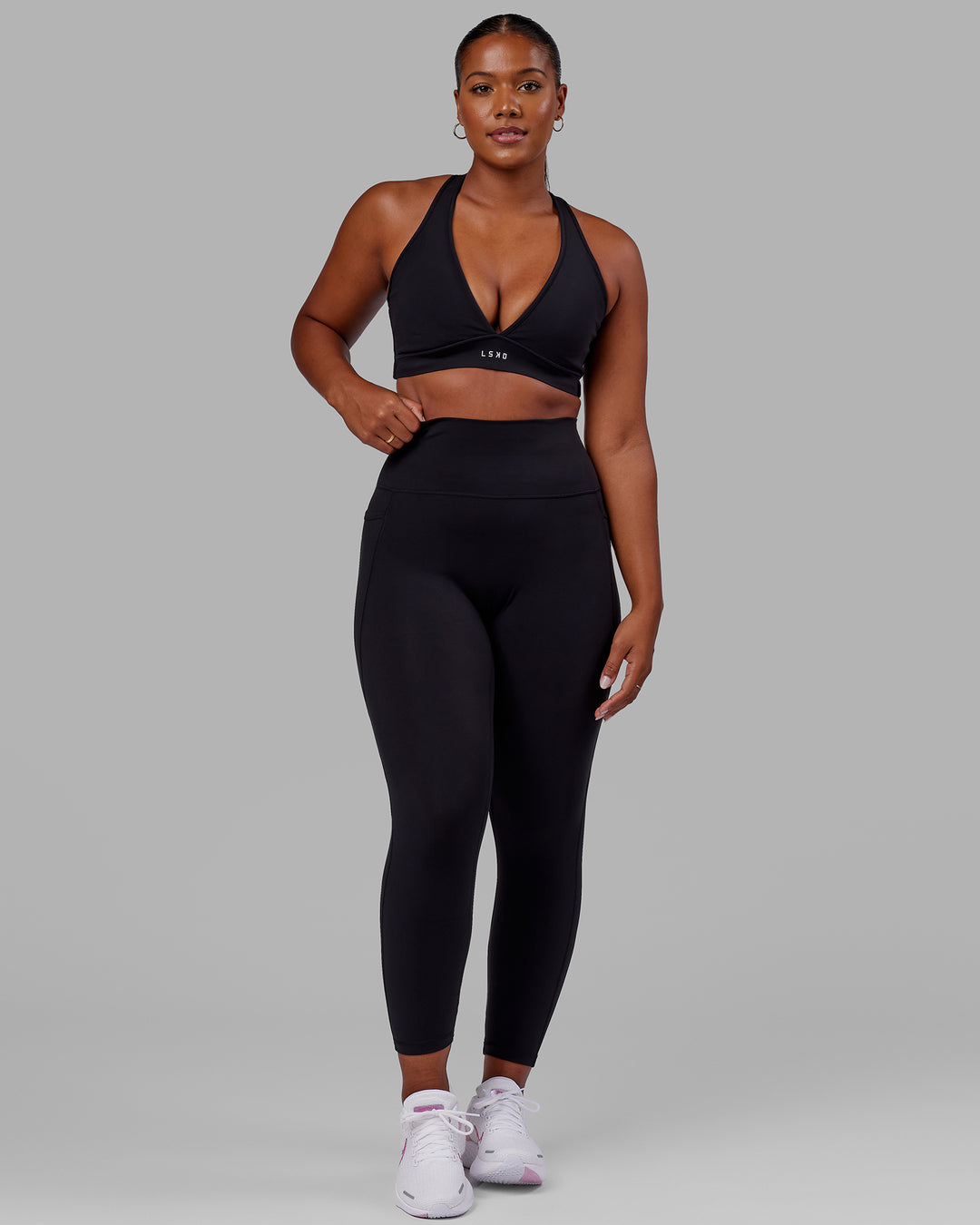 Woman wearing Fusion Ultra High-Rise Full Length Legging Pockets - Black Reflective | Model:Sierra | Size:L