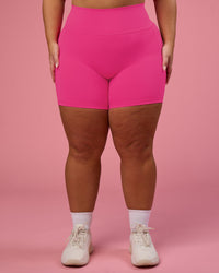 Woman wearing Fusion Ultra High-Rise 6" Short Pockets - Ultra Pink | Model:Bianca | Size:L