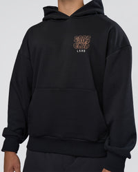 Man wearing GTC CVC Fleece Unisex Oversized Hoodie - Black-Cantaloupe | Model:Nikola | Size:L