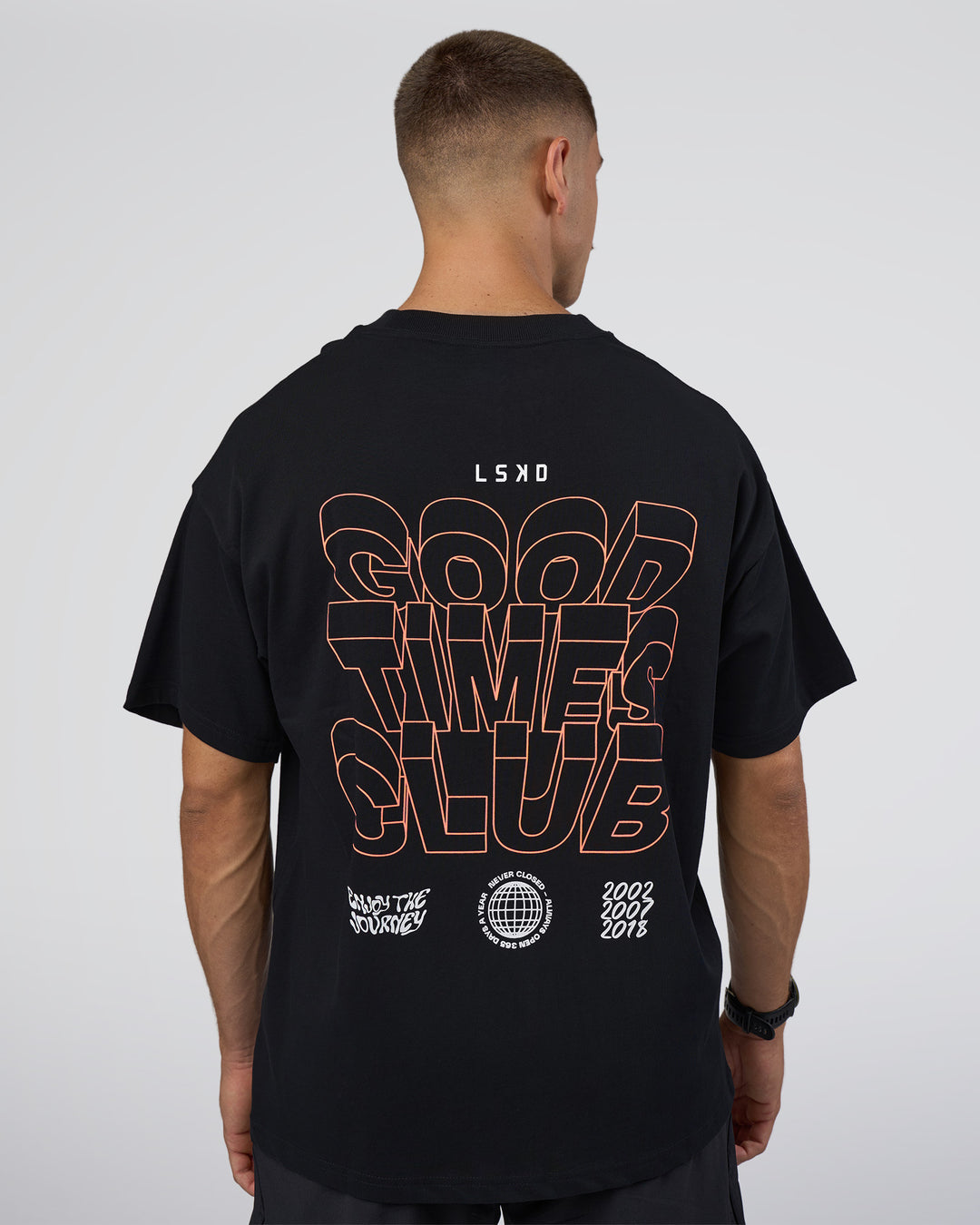 Man wearing GTC Heavyweight Oversized Tee - Black-Cantaloupe | Model:Nikola | Size:L