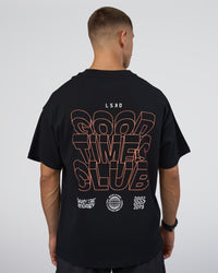 Man wearing GTC Heavyweight Oversized Tee - Black-Cantaloupe | Model:Nikola | Size:L