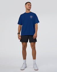 Man wearing GTC Heavyweight Oversized Tee - Washed Midnight Blue-Marsh | Model:Nikola | Size:L