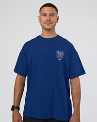 Man wearing GTC Heavyweight Oversized Tee - Washed Midnight Blue-Marsh | Model:Nikola | Size:L