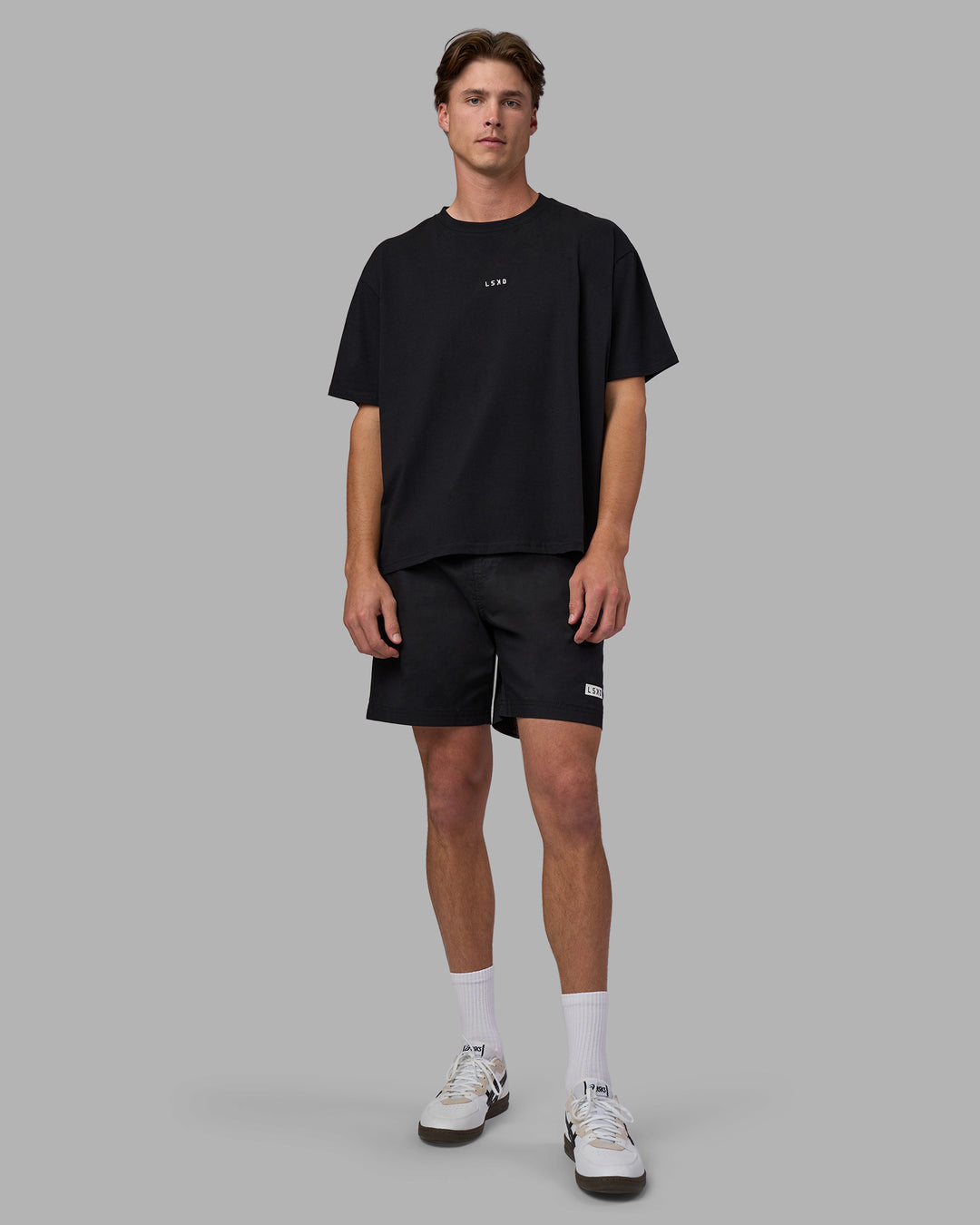 Man wearing Go-To FLXCotton Oversized Tee - Black-White | Model:Brandon | Size:L