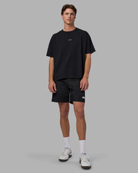 Man wearing Go-To FLXCotton Oversized Tee - Black-White | Model:Brandon | Size:L