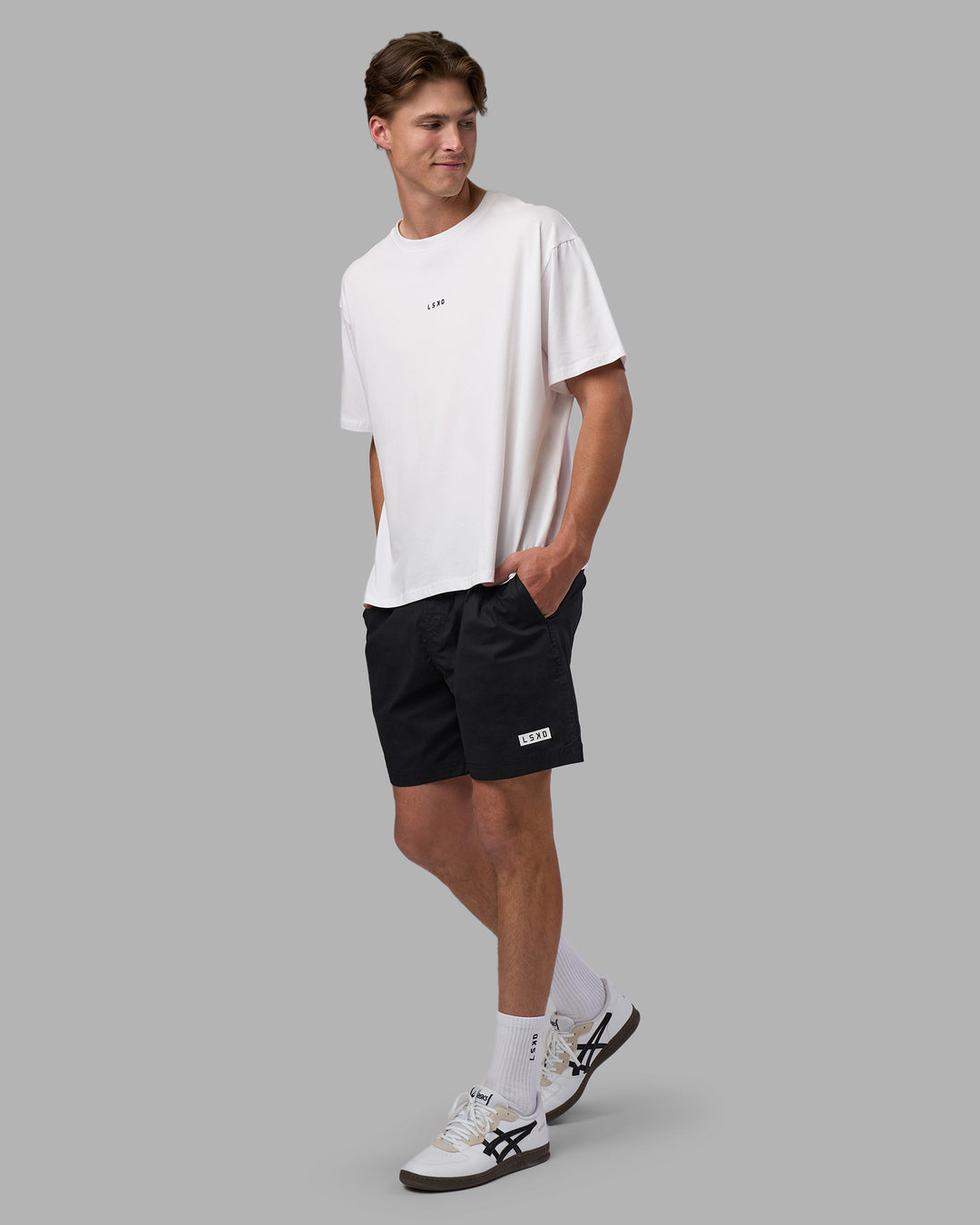 Man wearing Go-To FLXCotton Oversized Tee - White-Black | Model:Brandon | Size:L