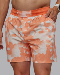Man wearing Grand Slam 6" Shorts in Wildflower Cantaloupe | Size:L