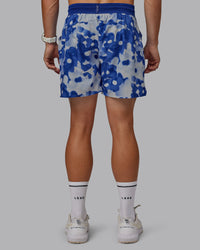 Man wearing Grand Slam 6" Shorts in Wildflower Midnight Blue | Size:L