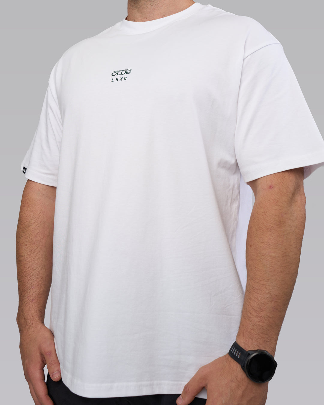 Man wearing Grass Roots CFC FLXCotton Oversize Tee - White | Model:Dean | Size:L