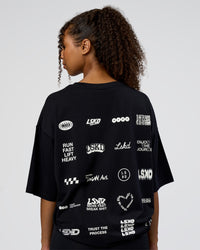 Woman wearing Grid FLXCotton Oversized Tee - Black-White | Model:Jordan | Size:L