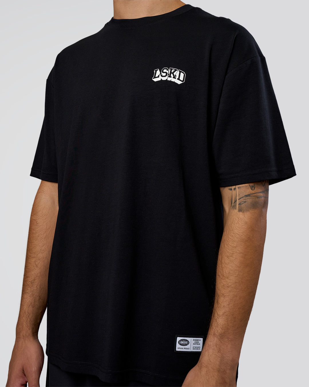 Man wearing Grid FLXCotton Oversized Tee - Black-White | Model:Zoran | Size:L