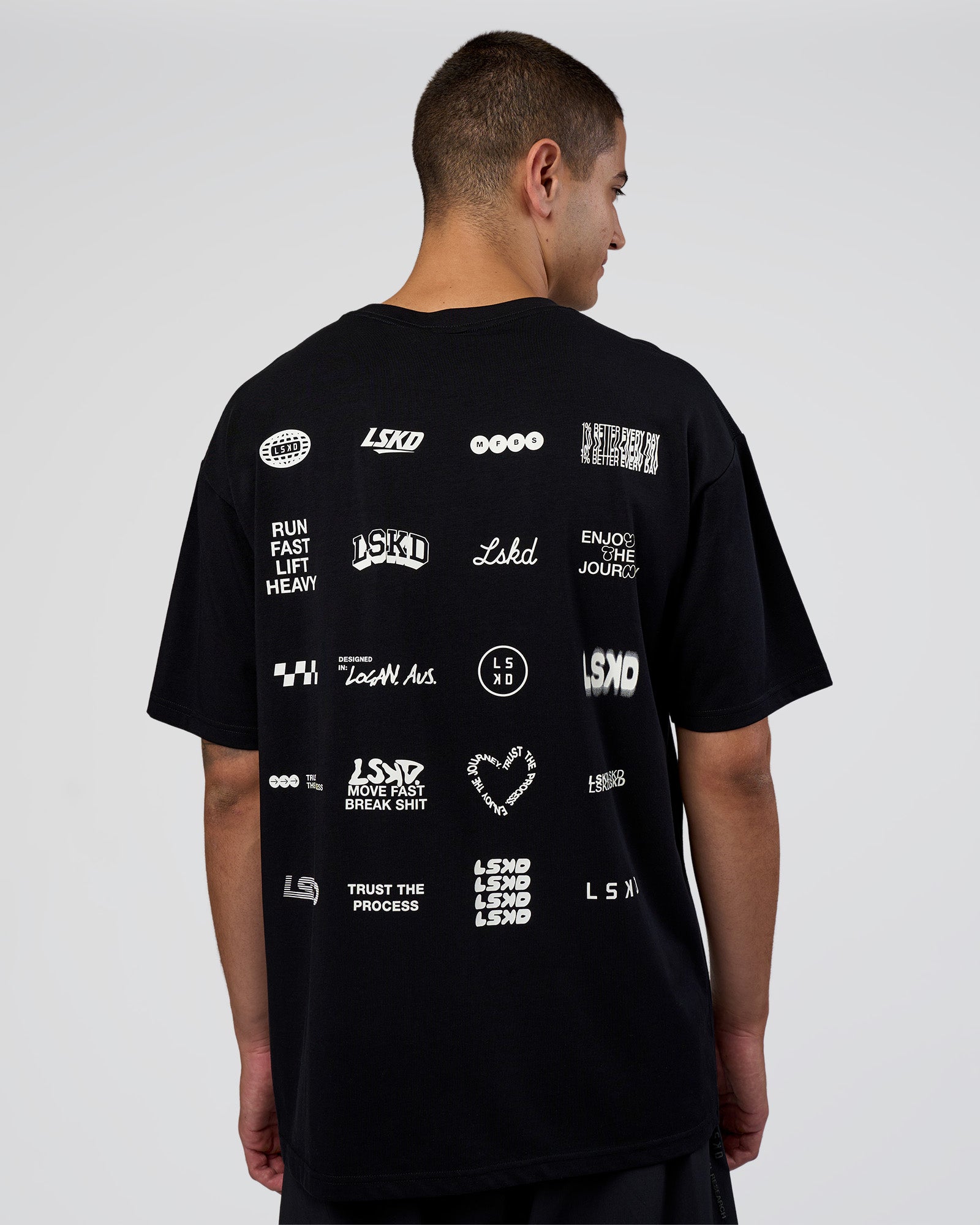 Man wearing Grid FLXCotton Oversized Tee - Black-White | Model:Zoran | Size:L