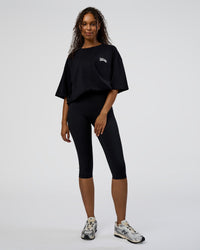 Woman wearing Grid FLXCotton Oversized Tee - Black-White | Model:Jordan | Size:L
