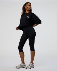Woman wearing Grid FLXCotton Oversized Tee - Black-White | Model:Jordan | Size:L