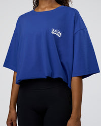 Woman wearing Grid FLXCotton Oversized Tee - Power Cobalt-White | Model:Jordan | Size:L