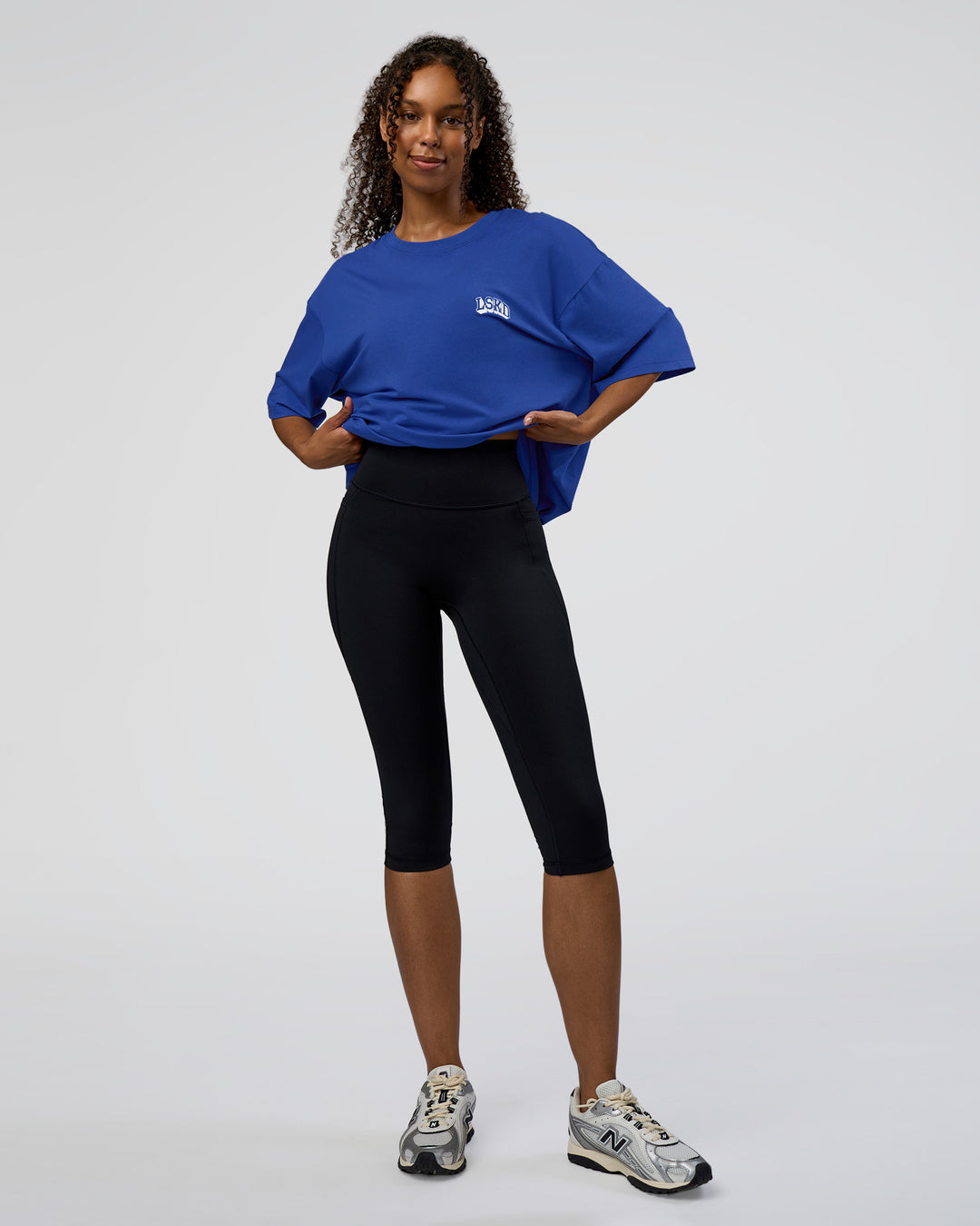 Woman wearing Grid FLXCotton Oversized Tee - Power Cobalt-White | Model:Jordan | Size:L