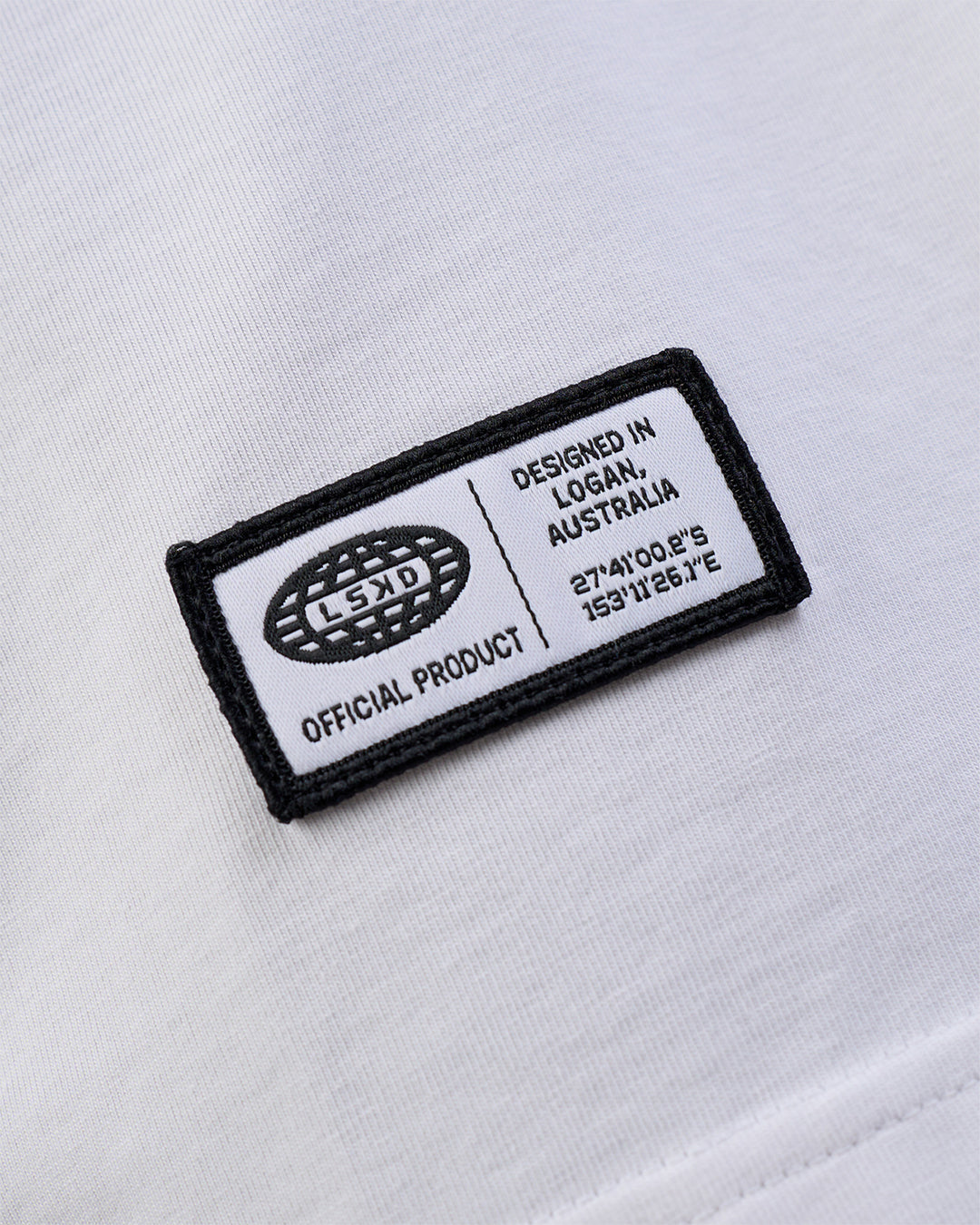 Man wearing Grid FLXCotton Oversized Tee - White-Black | Model:Zoran | Size:L