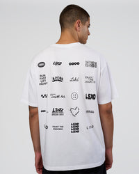 Man wearing Grid FLXCotton Oversized Tee - White-Black | Model:Zoran | Size:L