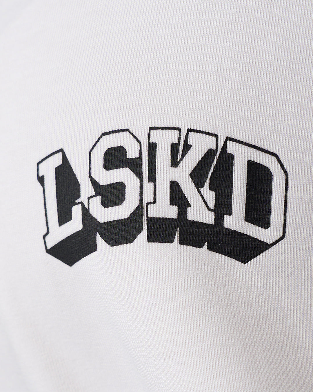 Woman wearing Grid FLXCotton Oversized Tee - White-Black | Model:Jordan | Size:L