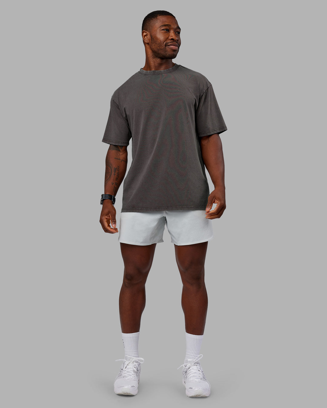 Man wearing Heart FLXCotton Oversized Tee - Washed Dark Storm-Violet Ray | Model:Sam | Size:L