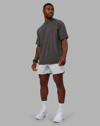Man wearing Heart FLXCotton Oversized Tee - Washed Dark Storm-Violet Ray | Model:Sam | Size:L