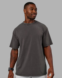 Man wearing Heart FLXCotton Oversized Tee - Washed Dark Storm-Violet Ray | Model:Sam | Size:L