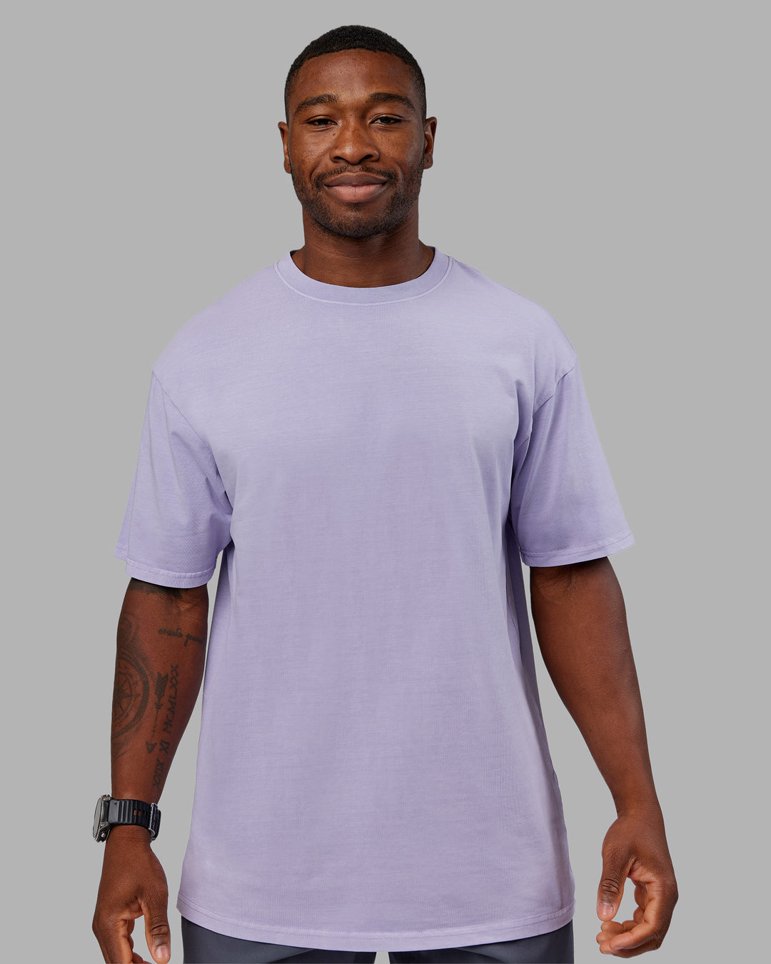 Man wearing Heart FLXCotton Oversized Tee - Washed Violet Ray-White | Model:Sam | Size:L
