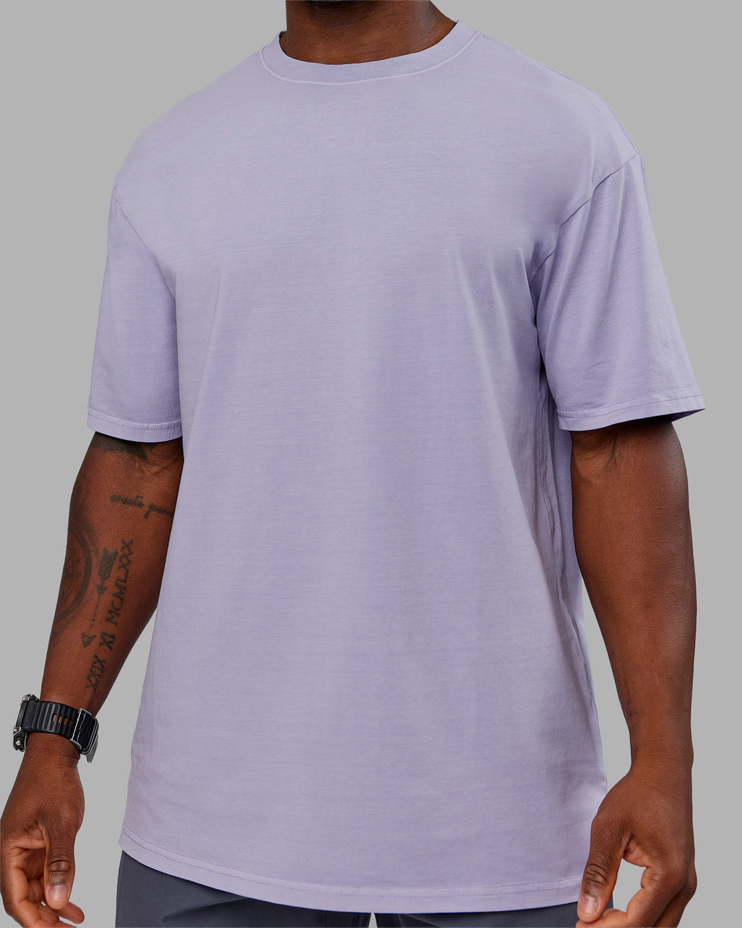 Man wearing Heart FLXCotton Oversized Tee - Washed Violet Ray-White | Model:Sam | Size:L