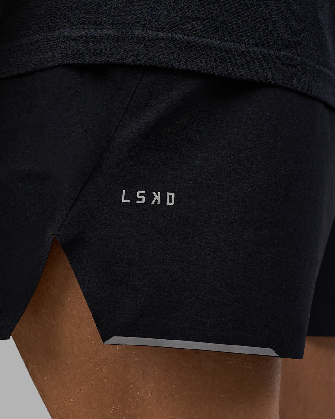 Man wearing Hybrid Lined 5&quot; Short - Black-Reflective | Model:Nikola | Size:L