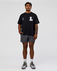 Man wearing Hype Heavyweight Unisex Oversized Tee - Black-White | Model:Xavier | Size:L | Thumbnail Index: 4