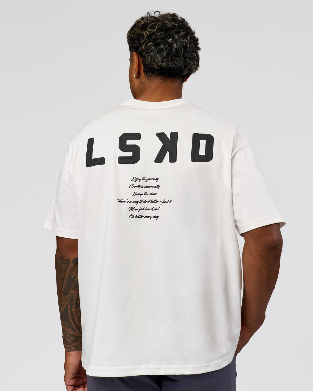 Man wearing Hype Heavyweight Unisex Oversized Tee - Off White-Black | Model:Xavier | Size:L