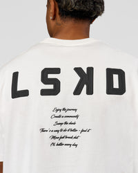 Man wearing Hype Heavyweight Unisex Oversized Tee - Off White-Black | Model:Xavier | Size:L